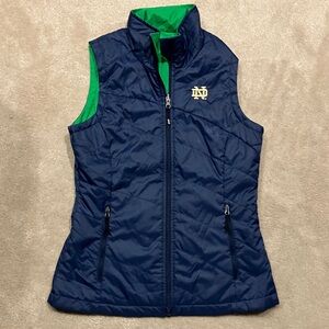 Columbia women’s Notre Dame Blue and Green reversable Vest